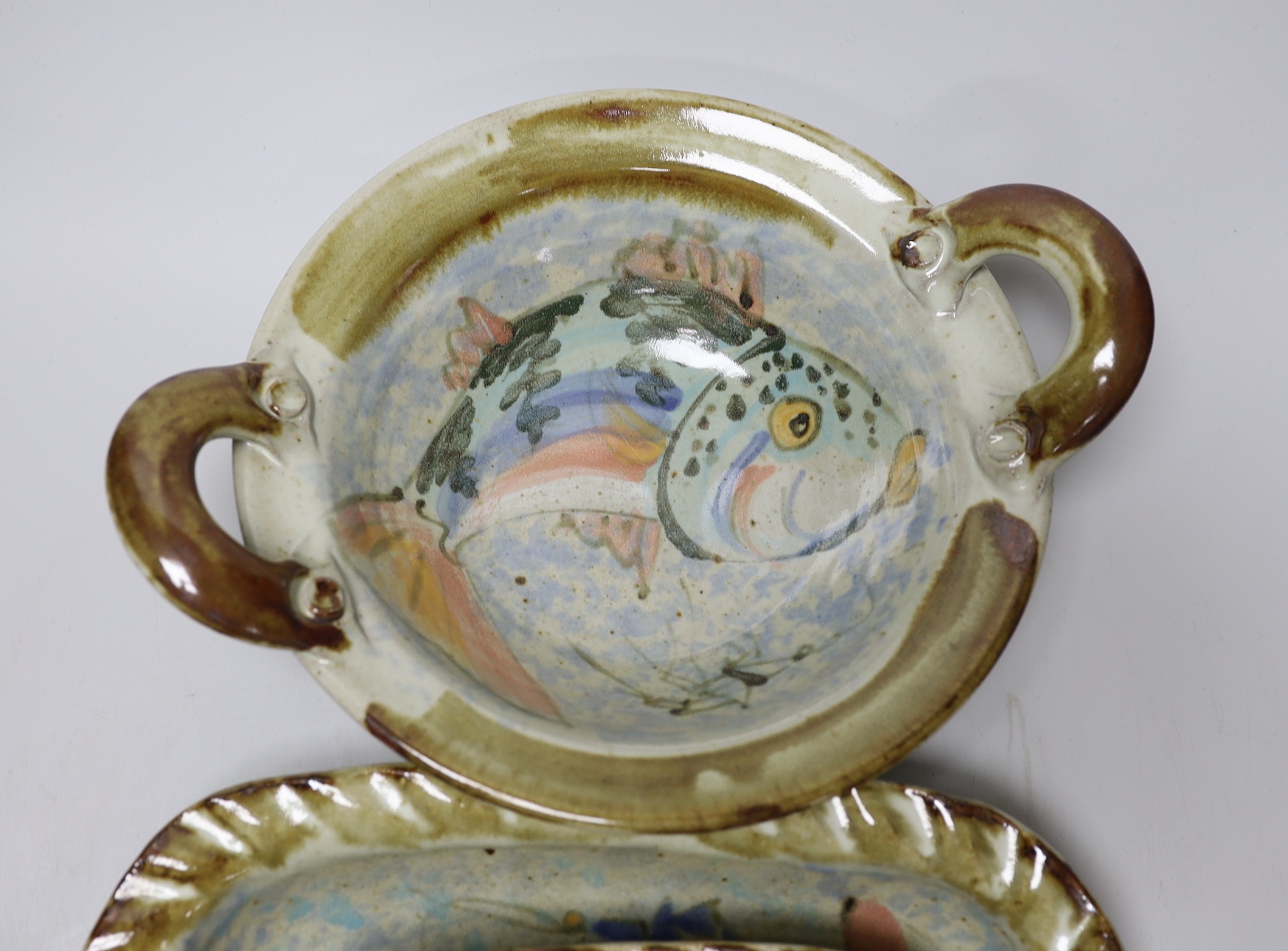 Three Roger Cockram pottery two handled dishes, largest 37cms